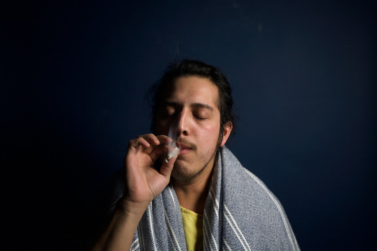 Guy Taking A Hit Of A Joint